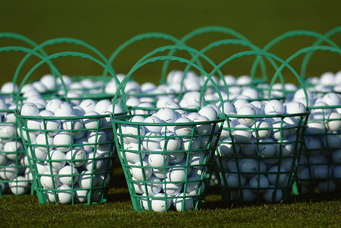 Buckets of golf balls.